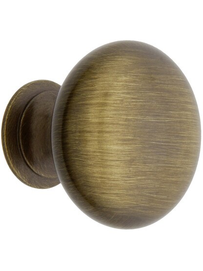 Classic Brass Cabinet Knob - 1 1/4 inch Diameter in Antique Brass.